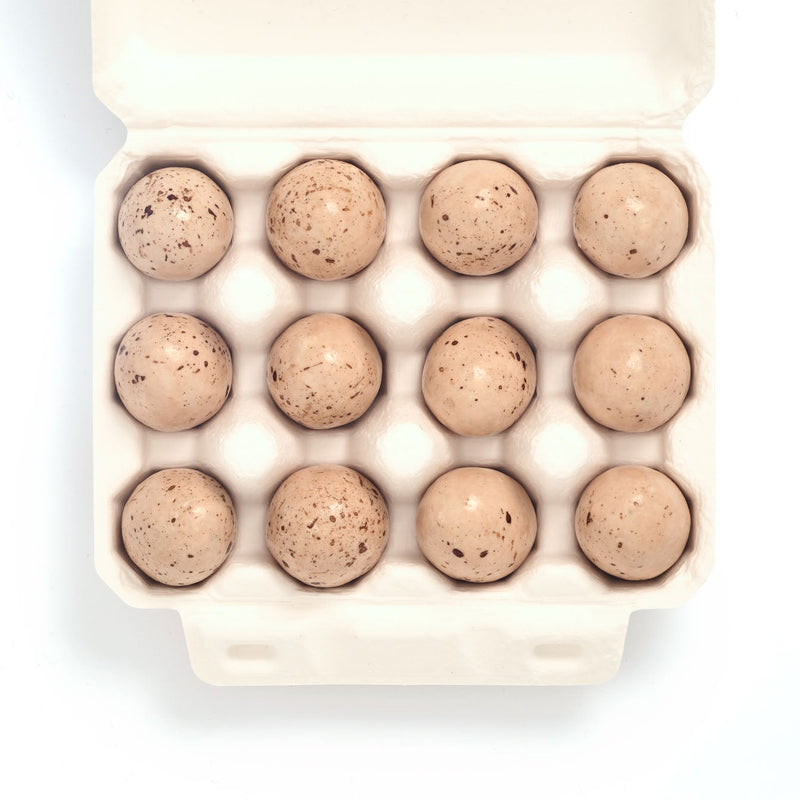 Zoom Pack of 12 Puffin Eggs with a puffin illustration on a white background Carton of eggs on a white background The Chocolate Detective - Puffin Eggs with Salted Caramel Ganache