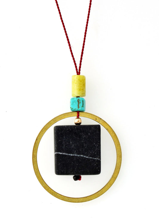 BLACKSTONE, PERIDOT JASPER, MAGNESITE AND BRASS CIRCLE NECKLACE ON RED SILK