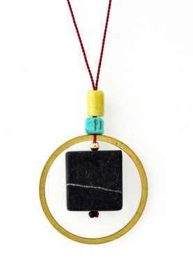 BLACKSTONE, PERIDOT JASPER, MAGNESITE AND BRASS CIRCLE NECKLACE ON RED SILK